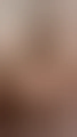 beautiful mature latina in glasses with oil on her sexy tits seduces the camera by squeezing her nipples