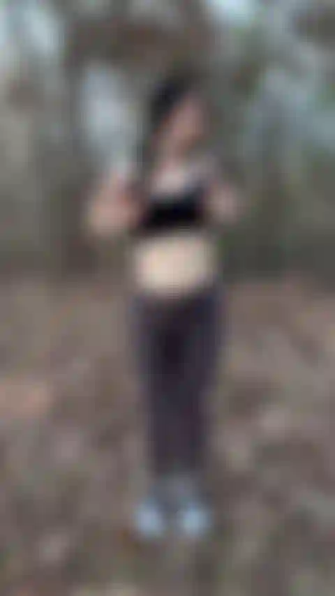 Outside jumping jacks in topless (clip).