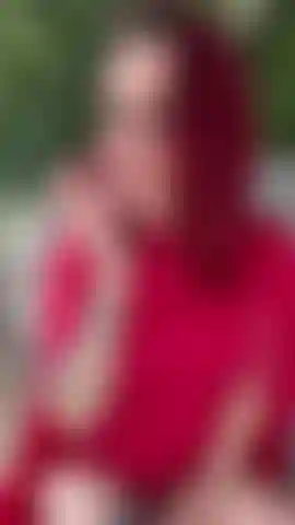 Sexy roof top smoking tease in red dress