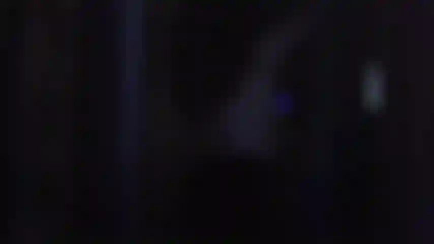 Topless dancing with glow-in-the-dark bracelets.