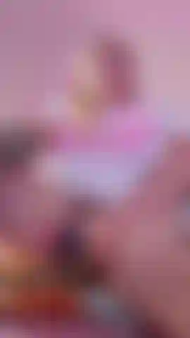 I'm perched on the edge of a chair, legs spread wide, so you get the perfect view. My fingers already slick as I trace slow, teasing circles around my swollen clit. I arch my back, letting my head fall back with a soft moan. My hips rock against my own touch, thighs trembling, pussy dripping onto the chair as I speed up—dildo plunging in deep, curling just right, gasping while I imagine it's your tongue. God, I'm so fucking wet for you...