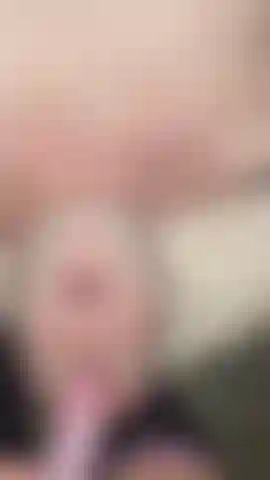 Man sucking strapon
