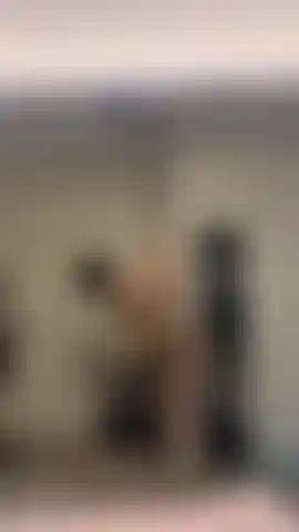 Pole dancing video doing upright and upside down stuff, wearing a green and black bra/panty duo and 8 inch black heels.