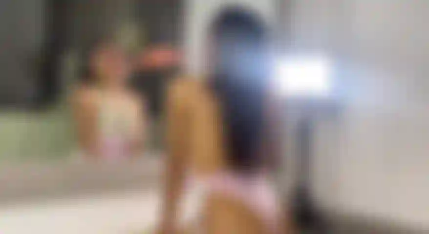 a latina sexy blowjob in front of the mirror