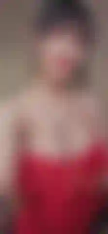 Teasing you with my boobs in a red corset. You can almost see my nips