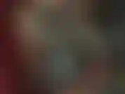 Adoratrice di una tuta in lattice semitrasparente color fumo.