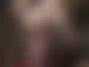 Sexy e sensuale, una padrona con i capelli corti, in nylon nero trasparente, con collant e body.