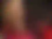 Culo e gambe in collant lucidi e tacchi alti.