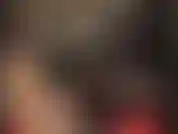 Con un cappuccio di gomma caldo per completare un sexy completo in lattice verde fumo, gonna, camicetta e calze.