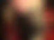 Stivali alti con i lacci, collant lucidi color cuoio scuro, pantaloncini sexy e hot.