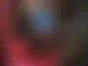 Indosso un vestito di lattice blu e stivali alti lucidi.