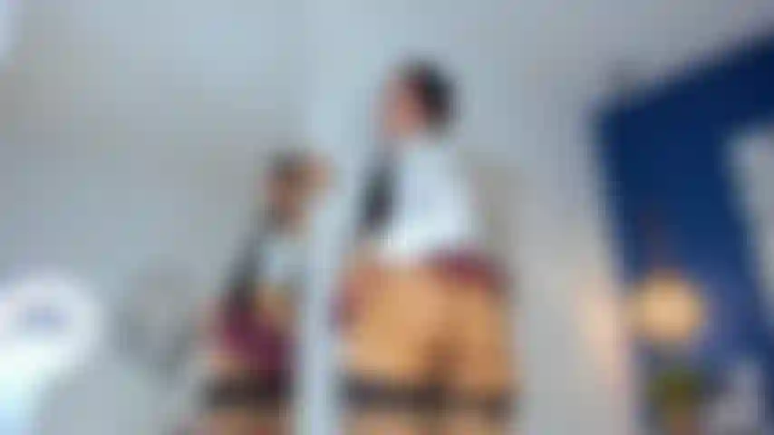 Naughty schoolgirl looks for her teacher alone in the classroom