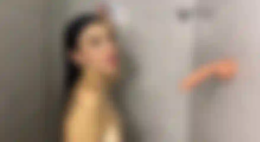 Horny young woman sucks hard, wet cock in the bathroom